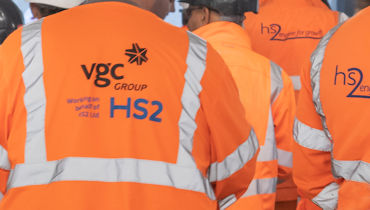 Group of HS2 workers with VGC logo in foreground