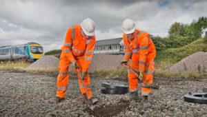 rail operatives working on the electrification programme near Blackpool